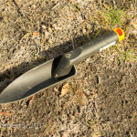 A small plastic trowel, ideal for reaching into crevices and for metal detecting.